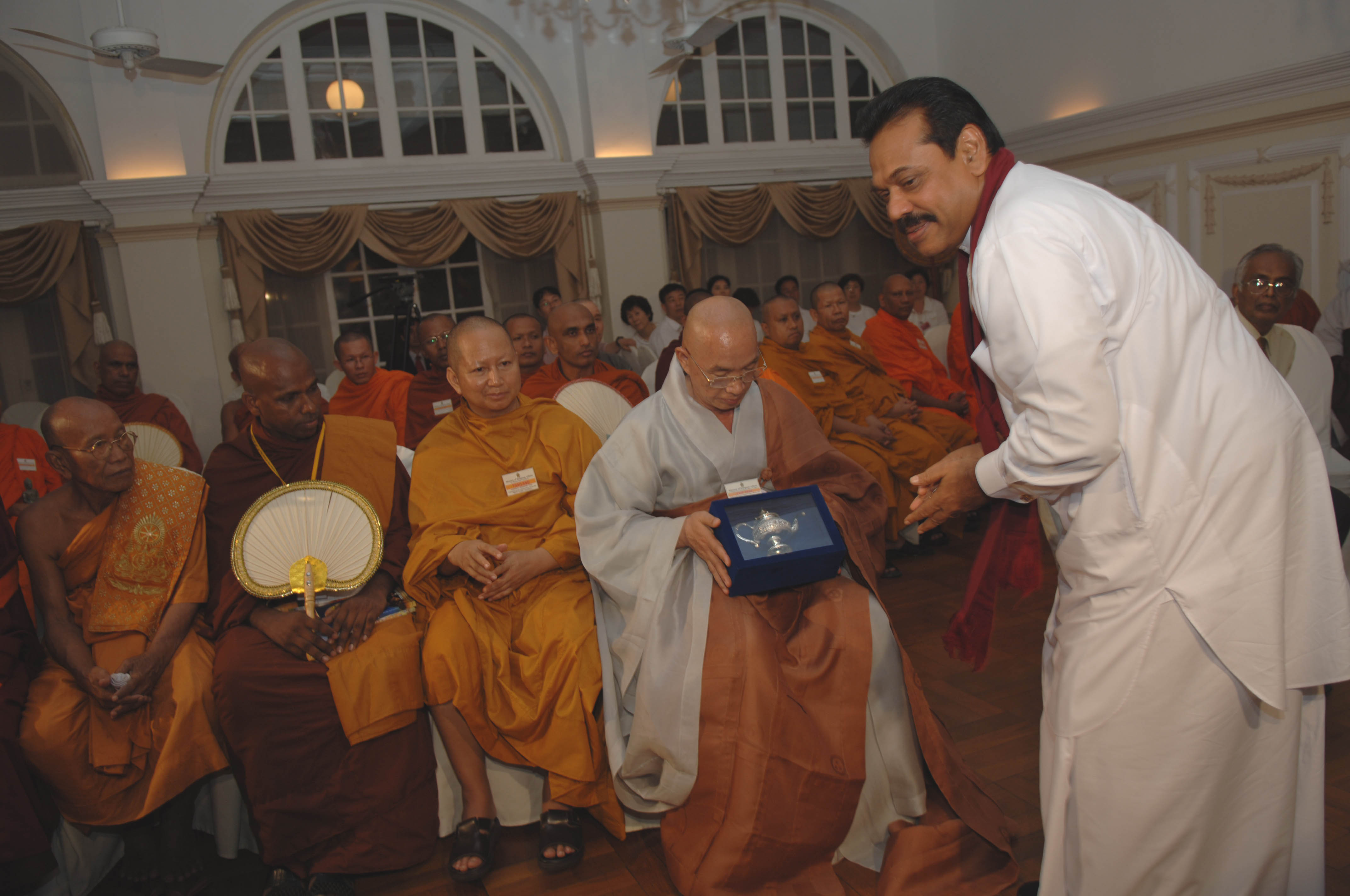 President offering a gift at President house on 17.05.2006 vesak day.jpg